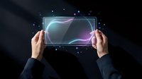 Hands holding transparent digital tablet with glowing neon wave interface and floating particles against dark background. For technology, innovation, digital design, and futuristic concepts.