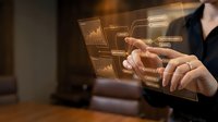 Businessman touching holographic digital interface with data analytics charts and graphs on transparent screen for modern technology presentation.