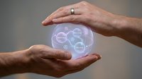 Protective hands safeguarding holographic brain with interconnected network nodes, symbolizing mental health care and cognitive protection concepts.