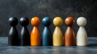 Colorful wooden pawns standing in row symbolizing diversity, teamwork and inclusion. Social concept showing unity and equality in workplace or community.
