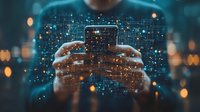 Person holding smartphone with glowing digital network overlay effect against dark background with bokeh lights, representing mobile connectivity and data.