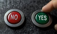 Red and green buttons with yes and no text on dark textured background, finger pointing to choice represents decision making and options selection process.