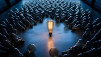 Glowing vintage Edison bulb surrounded by unlit bulbs in circular pattern on blue surface. Leadership, innovation, creativity and standing out concept.