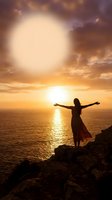 Woman silhouette with open arms facing ocean sunset from rocky cliff, expressing freedom and spiritual connection with nature in golden hour light.