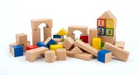 Colorful wooden building blocks set with geometric shapes, numbers and letters for children educational play and learning development on white background.