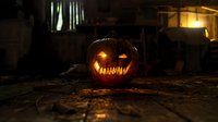 Glowing carved pumpkin with scary grin sits on dark wooden surface at night, illuminated by warm candlelight creating spooky Halloween atmosphere.