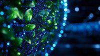 Glowing blue and green particles with bokeh effect create magical atmosphere against dark background, suitable for abstract science or technology designs.