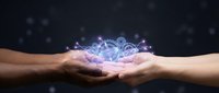 Hands holding glowing digital crown with sparkling effects against dark background for luxury branding and royal concept designs.