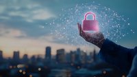 Glowing pink padlock floating above business person's hand against city skyline at dusk, representing digital security and data protection in modern technology.