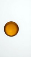 Empty amber glass bowl isolated on white background for product photography and design projects.