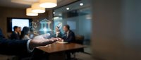 Businessman presenting digital security shield icons in modern office meeting room with colleagues discussing cybersecurity solutions and data protection.