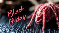 Black Friday promotional text in red script with burgundy knitted winter hat on dark wooden surface, suitable for seasonal sales marketing and holiday shopping campaigns.