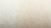 Natural beige linen fabric texture with woven fibers and organic cotton material surface for backgrounds, textiles and interior design projects.