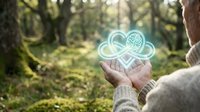 Hands holding glowing brain cloud icon in forest setting representing artificial intelligence, mental health awareness, and digital technology concepts.