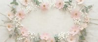 Delicate floral frame with soft pink flowers and white baby's breath on light background. Romantic border composition for wedding invitations and feminine designs.
