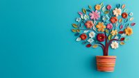 Colorful paper craft tree with vibrant flowers in striped pot against turquoise background. Creative handmade art composition with floral elements and leaves.