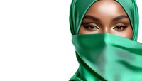 Young Middle Eastern woman wearing emerald green hijab and face covering, with expressive dark eyes and flawless makeup on white background.
