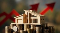 Wooden house model on stacks of coins with red growth arrows showing real estate investment success and property value appreciation in financial market.