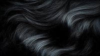 Luxurious black hair texture with flowing waves and silky smooth strands creating dynamic movement against dark background.