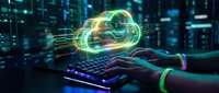Hands typing on illuminated keyboard with glowing cloud computing hologram in modern data center environment for digital technology and networking concepts.