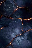 Dark stone surface with glowing orange cracks creating dramatic pattern. Volcanic rock texture with illuminated fissures resembling flowing lava or magma formation.