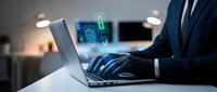 Professional businessman using laptop with digital security icons and cyber protection interface in modern office environment for technology presentations.