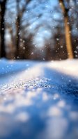 Magical winter forest scene with sparkling snow crystals in foreground and falling snowflakes against blurred trees, creating dreamy atmospheric mood.