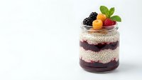 Healthy chia seed pudding parfait with fresh berries and mint in glass jar on white background. Nutritious breakfast dessert for wellness lifestyle.