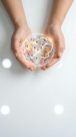 Hands holding transparent sphere containing miniature people figures and glowing light paths, representing global network, community connection, teamwork and business collaboration concepts.