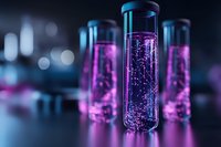 Glass test tubes with glowing pink liquid and bubbles on dark background with bokeh effect. Scientific laboratory research concept.
