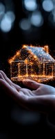 Glowing golden house outline floating above open palms with magical sparkles and light particles against dark background, creating ethereal real estate concept.