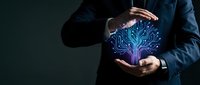 Businessman in dark suit holding glowing digital brain circuit pattern between hands, representing artificial intelligence, technology innovation, and digital transformation concepts.