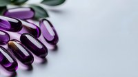 Purple translucent gel capsules or vitamin supplements scattered on white background with soft shadows and selective focus for pharmaceutical or health concepts.