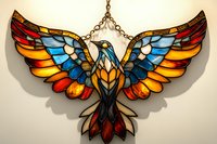 Stained glass eagle sun catcher with spread wings in vibrant blue, red, and amber colors against light background, mosaic style decorative piece for windows.