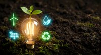 Glowing light bulb with green plant sprout and eco-friendly icons on soil background representing sustainable energy and environmental innovation concept.