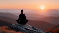 Person meditating on mountain rock at sunrise with layered hills and warm orange sky. Peaceful mindfulness and wellness concept for relaxation content.
