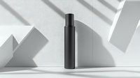 Minimalist black cosmetic bottle on white background with geometric shapes and soft shadow play. Clean skincare packaging mockup for luxury brand presentation.