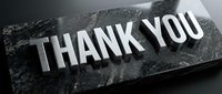 Metallic thank you text on dark granite stone surface, suitable for gratitude cards, business presentations, and appreciation graphics.
