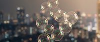 Floating soap bubbles against blurred city lights background creating dreamy atmospheric scene for creative projects and artistic compositions.