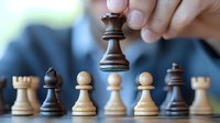 Dark wooden queen chess piece held above white and black pawns on chessboard, demonstrating strategic gameplay and leadership concept in business setting.