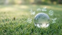Crystal globe on green grass with floating eco-friendly icons representing renewable energy, recycling, and sustainable living concepts for environmental awareness.