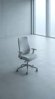 Modern gray office chair with adjustable armrests positioned in minimalist white interior space with floor-to-ceiling windows, suitable for corporate workspace and furniture design projects.