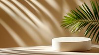 Minimal product display platform with palm leaf shadow on beige background, round white podium for cosmetic presentation in natural sunlight effect.