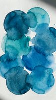 Abstract watercolor blue paint blobs with organic flowing shapes on white paper background for artistic design projects and creative layouts.