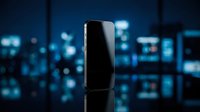 Smartphone with blank black screen displayed against blurred blue digital interface background, suitable for app mockups and technology marketing.