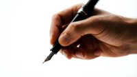 Male hand with medium skin tone holding fountain pen, writing or signing document, isolated on white background for design, business, education, and stationery projects.