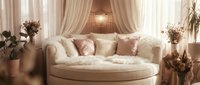 Luxurious cream-colored round sofa with plush cushions in an elegant interior space featuring draped curtains, pendant lighting, and dried floral arrangements for home decor styling.