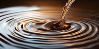 Liquid splash creating concentric ripples on dark surface with golden brown tones, dramatic macro photography capturing moment of impact and fluid dynamics.