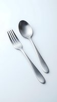Modern stainless steel fork and spoon set isolated on white background for kitchen dining restaurant culinary design projects.