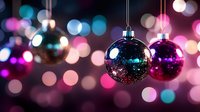 Hanging ornaments with glitter and sparkles against blurred bokeh lights in pink, blue, and purple tones. Festive holiday decoration for seasonal designs and celebrations.